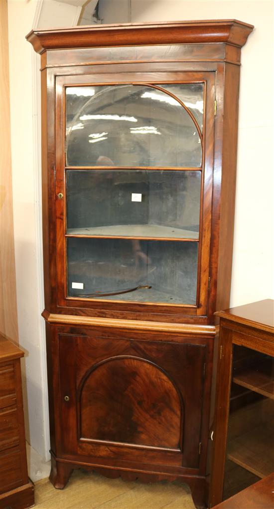 A Mahogany corner cupboard, c.1830, H.218cm